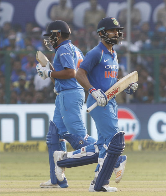 Virat Kohli and Rohit Sharma of India celebrates his half century during the third ODI match between India and New Zealand at Green Park Stadium in Kanpur. Virat Kohli and Rohit Sharma of India celebrates his half century during the third ODI match between India and New Zealand at Green Park Stadium in Kanpur.