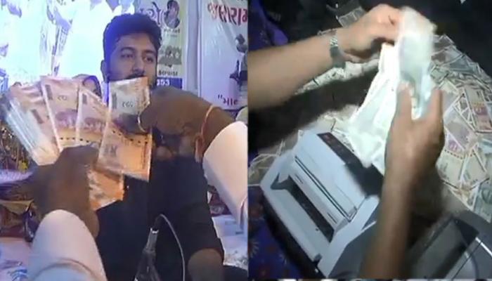 VIDEO : भक्ति संगीत में होने लगी नोटों की बरसात, रुपये गिनने के लिए लगानी पड़ी मशीन VIDEO : भक्ति संगीत में होने लगी नोटों की बरसात, रुपये गिनने के लिए लगानी पड़ी मशीन