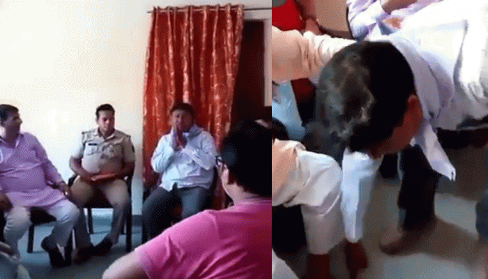 अलीगढ़ में दलित शिक्षक का अपमान, थाने में बीजेपी नेता के पैर छूकर मांगनी पड़ी माफी अलीगढ़ में दलित शिक्षक का अपमान, थाने में बीजेपी नेता के पैर छूकर मांगनी पड़ी माफी