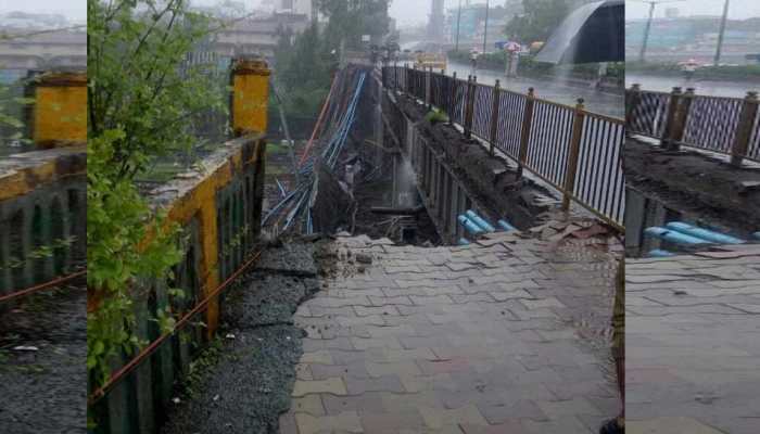 मुंबई: अंधेरी में फुटओवर ब्रिज का हिस्सा गिरने से 2 लोग घायल, यातायात प्रभावित मुंबई: अंधेरी में फुटओवर ब्रिज का हिस्सा गिरने से 2 लोग घायल, यातायात प्रभावित