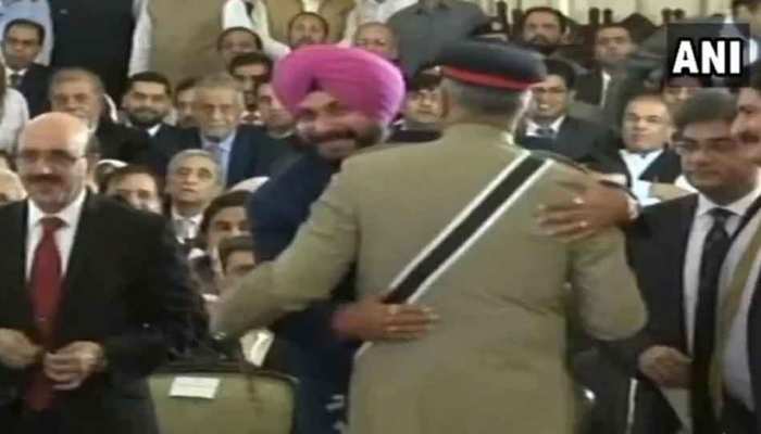 Sidhu hug Pakistan Army Chief General Qamar Javed Bajwa and seated next to Pok president at Imran Khan&#039;s oath ceremony