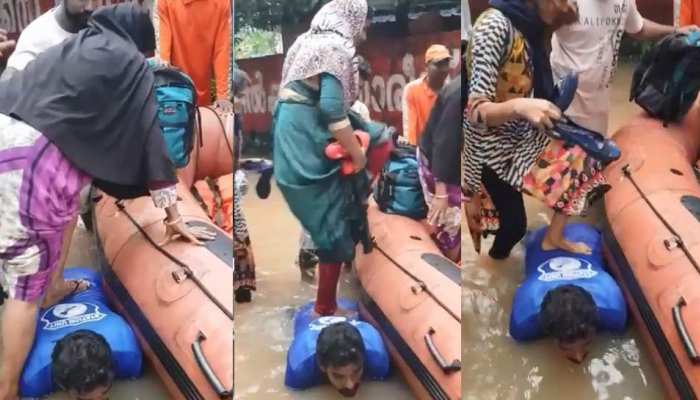 VIDEO : केरल बाढ़ में NDRF कर्मी बना सीढ़ी, पीठ पर पैर रखकर नाव में उतरे लोग VIDEO : केरल बाढ़ में NDRF कर्मी बना सीढ़ी, पीठ पर पैर रखकर नाव में उतरे लोग
